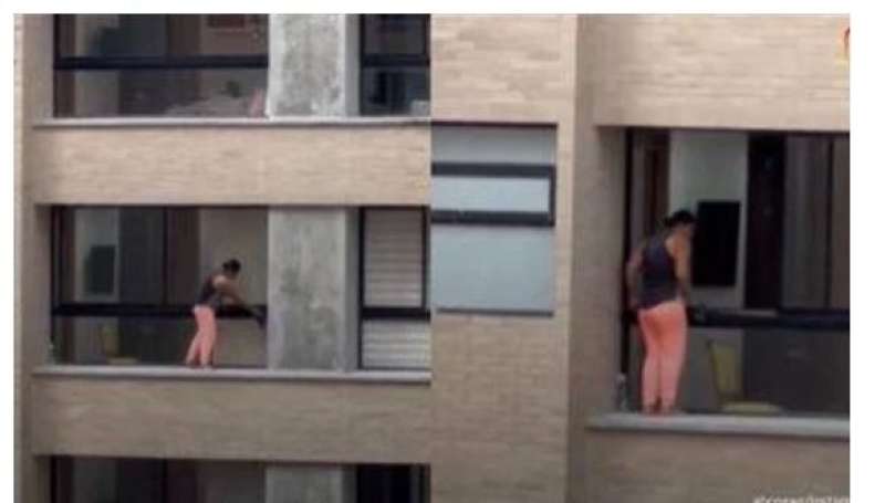 امرأة على حافة مبنى شاهق-متداول سوشيال